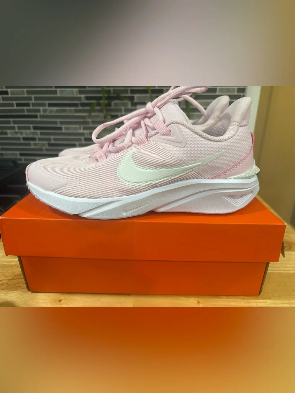 Athletic comfy breathable Nike Pink Running Shoe with White logo.